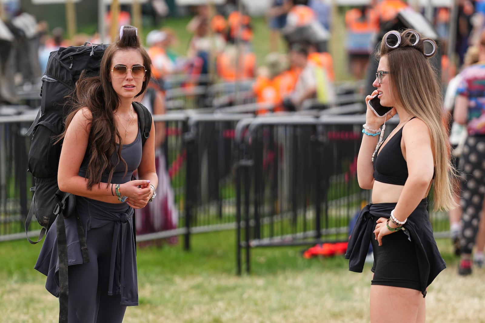 Festival goers arrive at the Glastonbury Festival in Worthy Farm, Somerset, England, Wednesday, June 25, 2025. (Scott A Garfitt/Invision/AP)