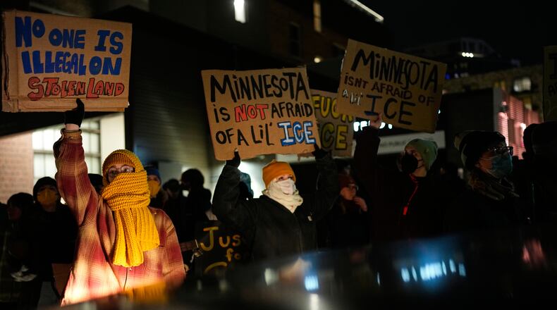 People participate in a protest and noise demonstration calling for an end to federal immigration enforcement operations in the city, Friday, Jan. 9, 2026, in Minneapolis. (AP Photo/John Locher)