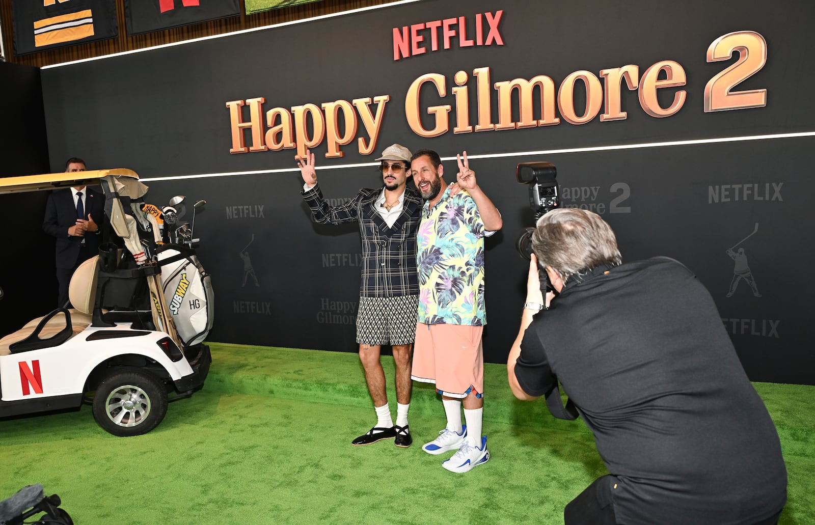 Bad Bunny, left, and Adam Sandler attend the premiere of Netflix's "Happy Gilmore 2" at Jazz at Lincoln Center on Monday, July 21, 2025, in New York. (Photo by Evan Agostini/Invision/AP)