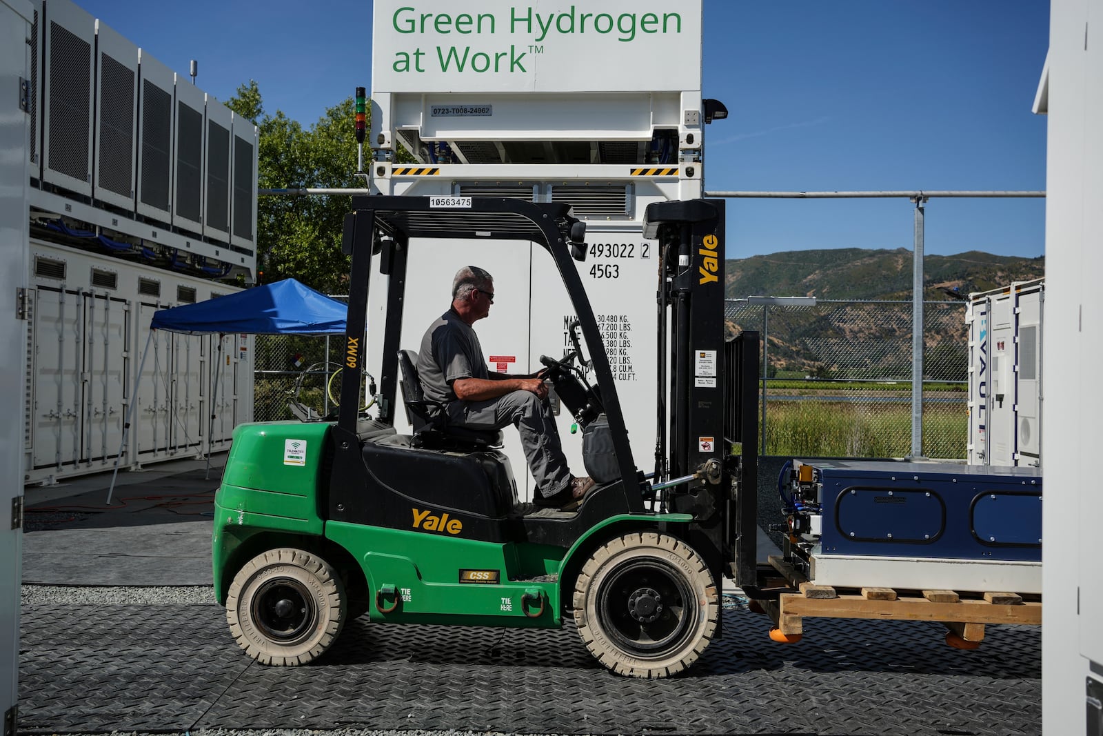 An employee drives a forklift at Energy Vault, a company that is creating an emergency power system that relies on hydrogen and battery storage, on Tuesday, May 27, 2025, in Calistoga, Calif. (AP Photo/Annika Hammerschlag)