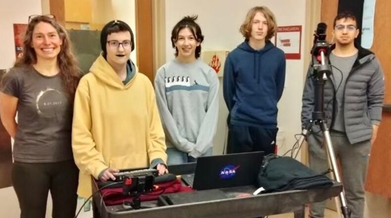 Teachers often get their classroom lessons from many real-world sources but local instructors said the coming, historic solar eclipse is an educational gift from out of this world. Local K-12 classrooms, and those nationwide, have been using the run up to Monday’s total solar eclipse to learn more. Pictured is Talawanda High School teacher Heidi Schran and some of her students involved in an eclipse project and science equipment provided by a federal science grant. CONTRIBUTED