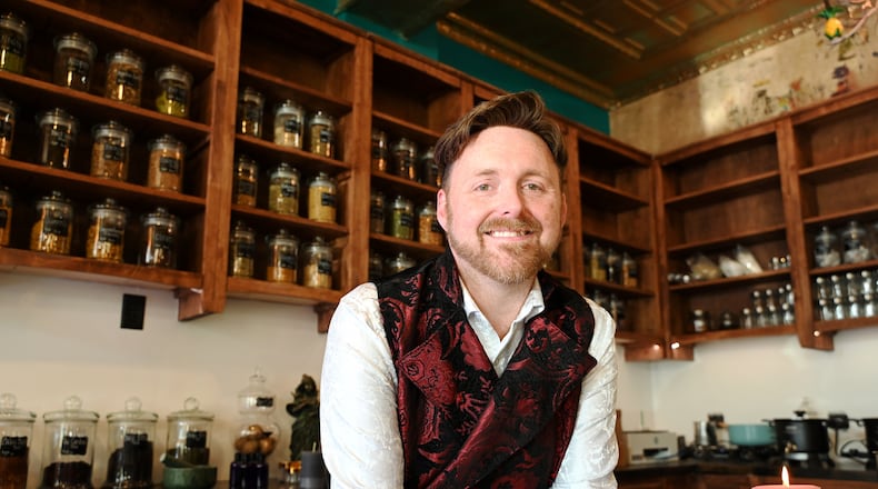 Arius and Phos, an apothecary and botanica sharing space inside Seraph by the River at 118 Main St. in Hamilton, is now open for business. Owner Isaac Reed (pictured) said the store has everything for one's mystical needs, from teas and candles to tarot cards and books. MICHAEL D. PITMAN/STAFF