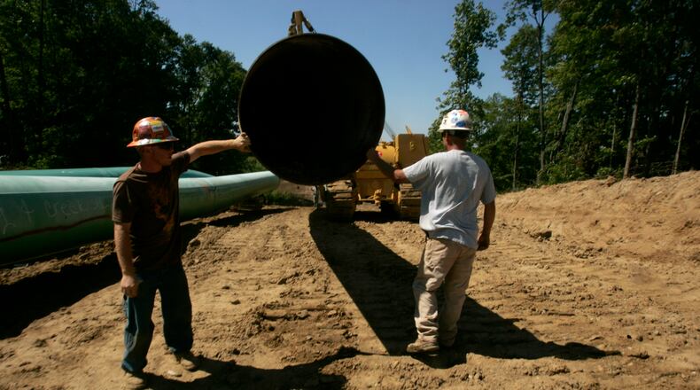 Swampers layout pipeline in 2008 in central Indiana that will eventually make it to Warren County. The 5 billion dollar project will move natural gas from the Rocky Mountains. Jim Noelker/Dayton Daily News