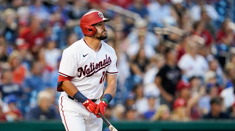 Washington Nationals' Kyle Schwarber watches his solo home run during the fifth inning of a baseball game against the New York Mets at Nationals Park, Monday, June 28, 2021, in Washington. (AP Photo/Alex Brandon)