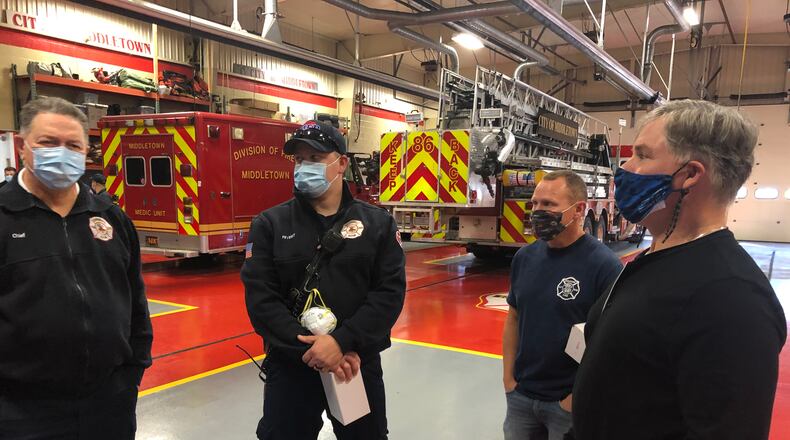 Phil Keegan, 58, who founded the lacrosse programs at John XXIII and Fenwick High School, suffered a heart attack one year ago. On Monday, the one-year anniversary, he gave his “heroes” insulated tumblers. From left: Chief Paul Lolli, Jeff Hobbs, Tate Cobb and Keegan. RICK McCRABB/STAFF