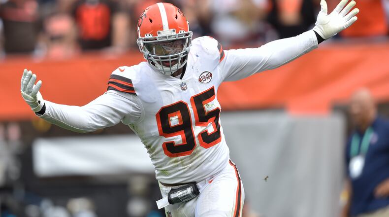 Cleveland Browns defensive end Myles Garrett celebrates after sacking Chicago Bears quarterback Justin Fields during the second half of an NFL football game, Sunday, Sept. 26, 2021, in Cleveland. (AP Photo/David Richard)