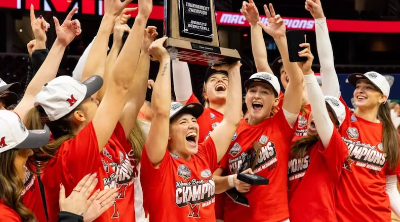 The Miami women's basketball team celebrates after winning the Mid-American Conference tournament on Saturday at Rocket Arena. MIAMI ATHLETICS PHOTO