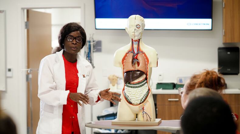 The death of a hospitalized family member in Ghana, West Africa due to a shortage of nurses both haunted and motivated Effe Addae, who later to come to America to earn a degree in nursing to ensure those suffering will never again lack those who care. Now an American citizen and married mother of four, Addae - shown her helping to instruct a nursing class - will step on to a stage this weekned during commencement at the Goggin Ice Center in Oxford and receive her Bachelor of Science in Nursing diploma earned through classes at Miami University’s Hamilton regional campus. CONTRIBUTED