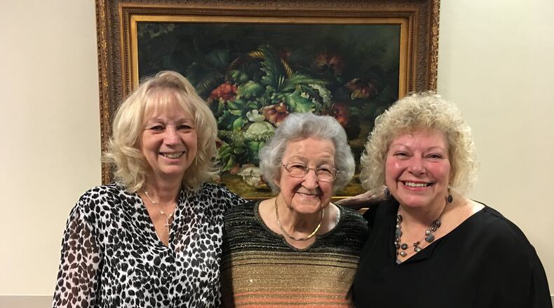 Kathie Bowling, activities assistant at Bradford Place (left) poses with resident Eunice Murphy who is turning 100 on Saturday (center) and Redina Smith, activities director (right).