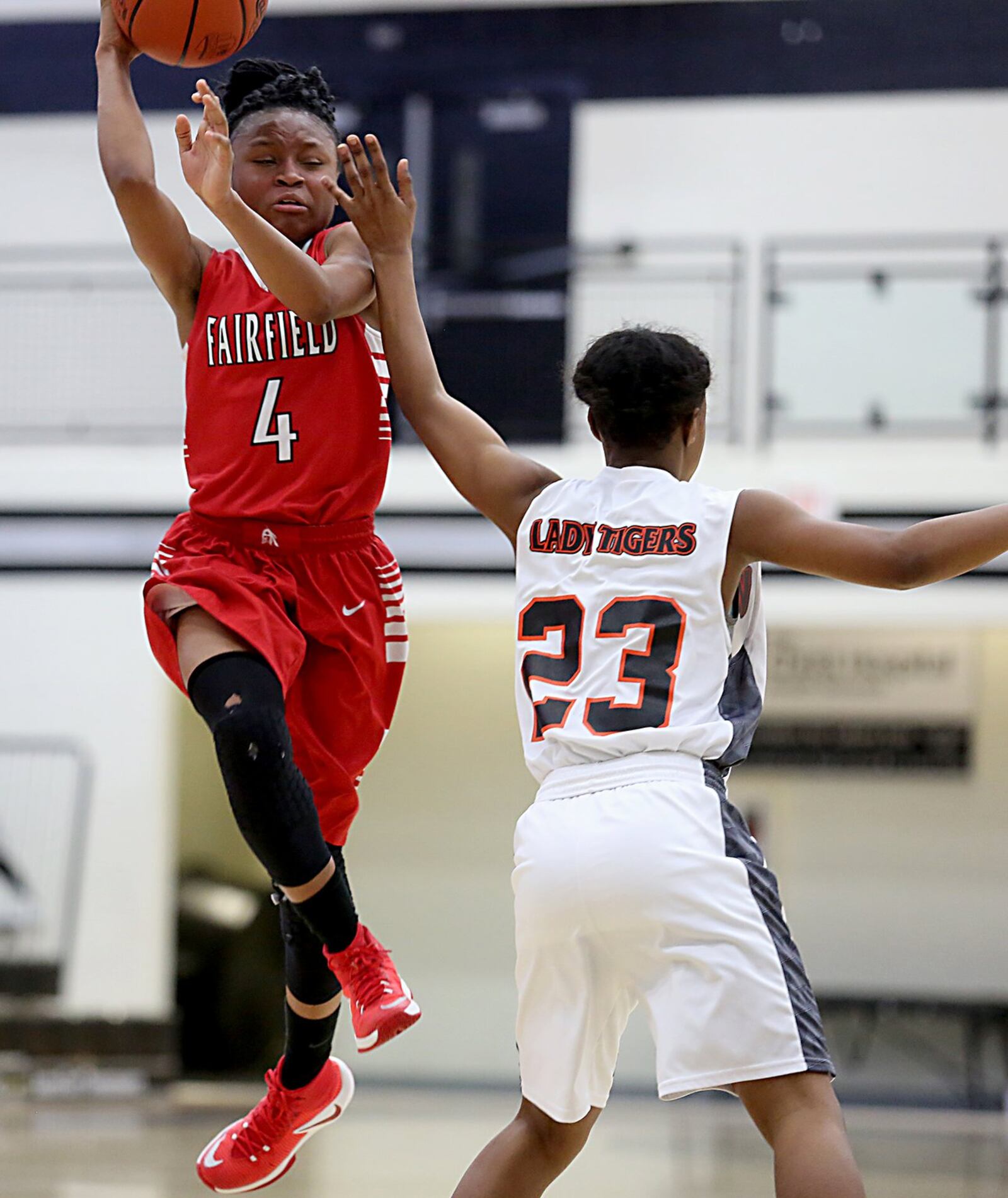 Fairfield guard Zahrya Bailey soars over Withrow guard Jaenay Hines on Saturday afternoon during Division I sectional play at Lakota East. CONTRIBUTED PHOTO BY E.L. HUBBARD