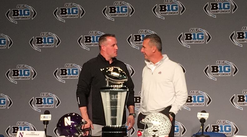 Urban Meyer and Pat Fitzgerald talk during a press conference Friday afternoon in Indianapolis to preview the Big Ten championship game.