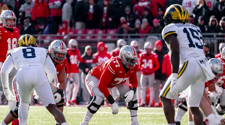 Ohio State's Tegra Tshabola lines up vs. Michigan during a game earlier this season. Tshabola, a 2021 Lakota West graduate, has started every game this season for the Buckeyes. Ohio State Athletics photo