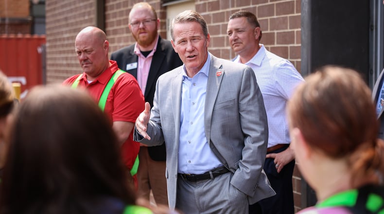 Sen. Jon Husted talks to Stebbins High School students on Friday, Sept. 5 during a tour of the school's career technology center. BRYANT BILLING / STAFF