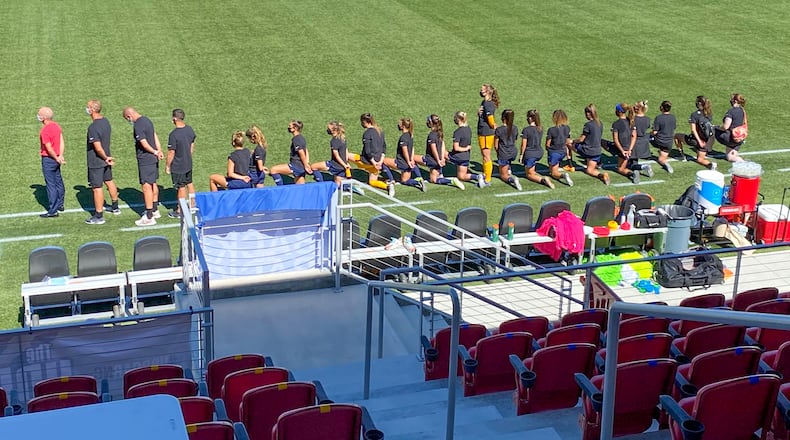 Samantha Leshnak-Murphy, a goalie for the North Carolina Courage, a member of the National Women’s Soccer League, stood for the National Anthem Saturday night while her teammates knelled. CONTRIBUTED BY ALEX VEJAR / THE SALT LAKE TRIBUNE.