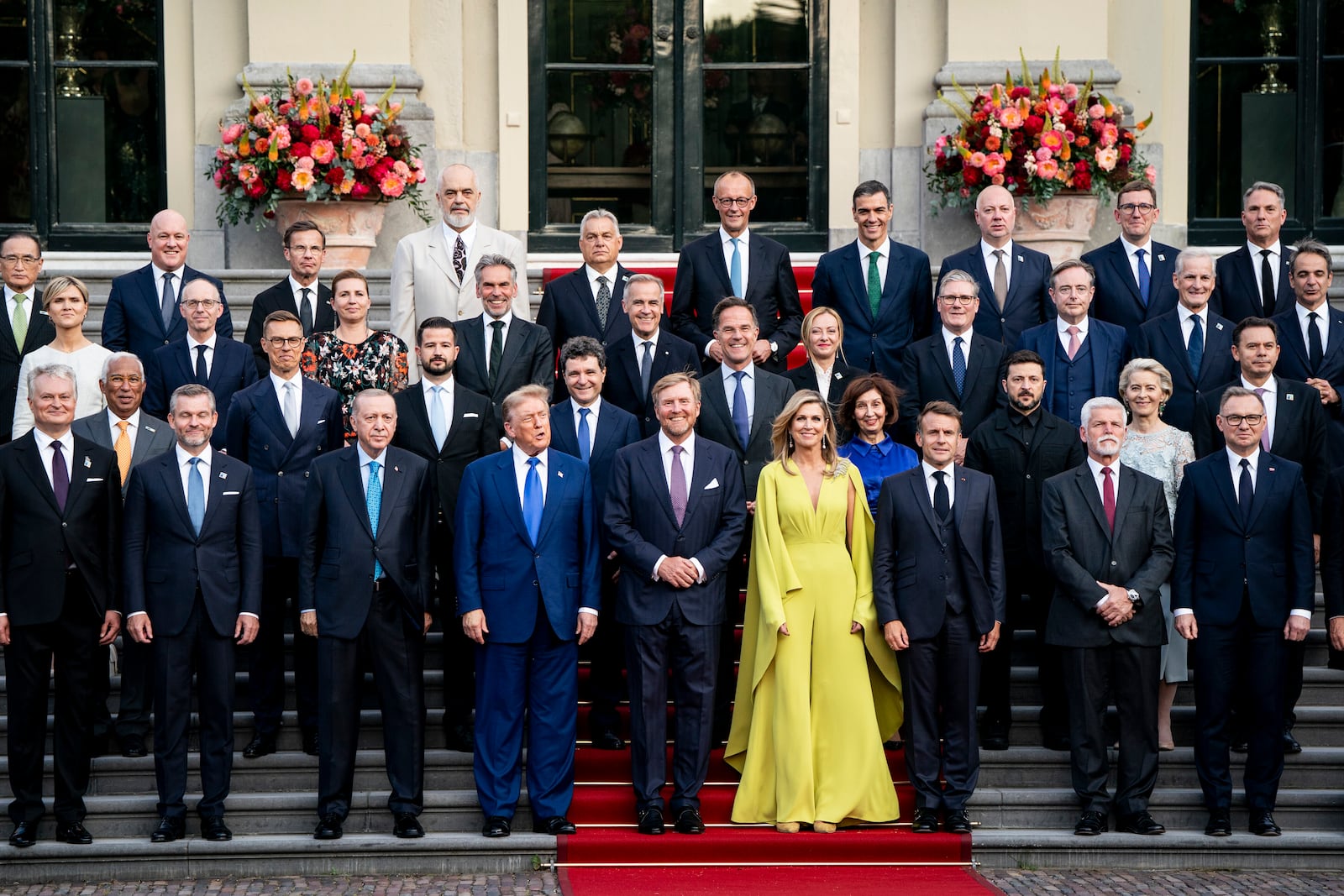 US President Donald Trump, center left, along with the King Willem-Alexander and Queen Maxima of the Netherlands, center, poses for a family photo at the 2025 NATO summit in The Hague, on Tuesday, June 24, 2025. (Haiyun Jiang/Pool Photo via AP)
