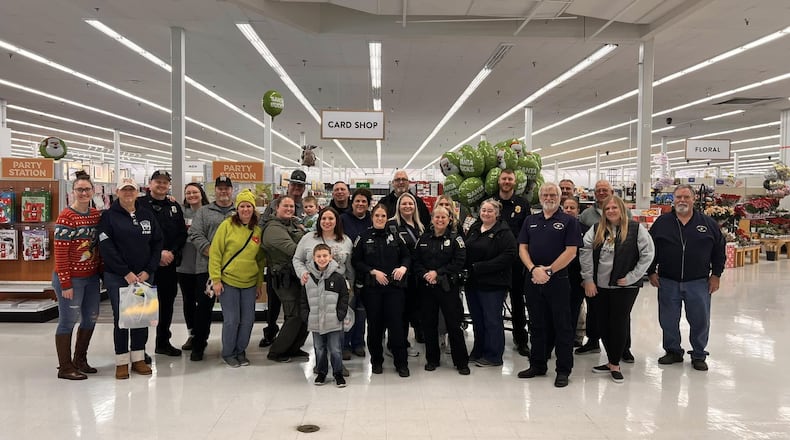 The decades old annual Mike Davis Shop With a Cop happened Saturday with 70 kids and Middletown police employees hitting the isles for Christmas presents. MIDDLETOWN DIVISION OF POLICE