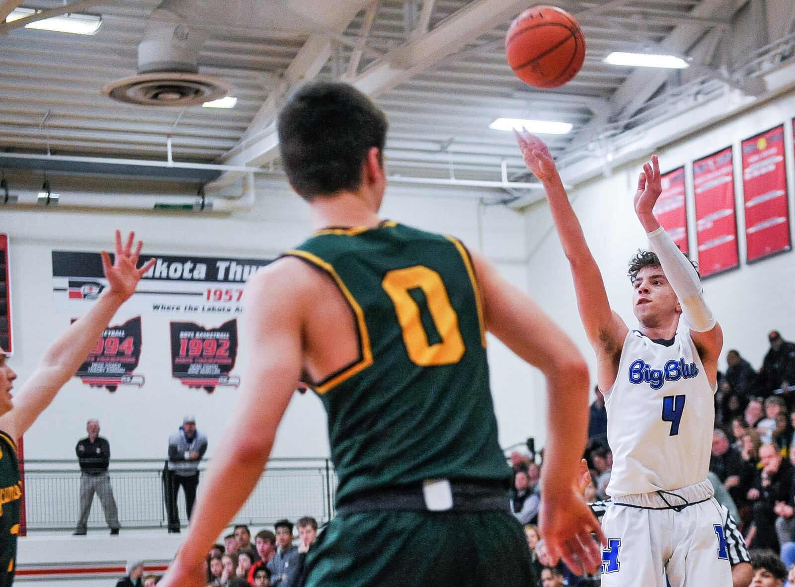 Hamilton’s Jaylen Robinson puts up a shot over Sycamore’s Cort Kramer (0) during Thursday night’s Division I sectional basketball game at Lakota West. Sycamore won 47-44. NICK GRAHAM/STAFF