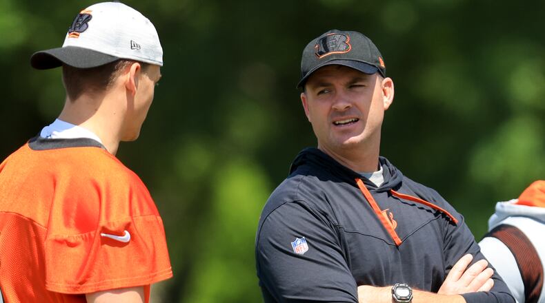 Cincinnati Bengals' Zac Taylor, right, talks with Joe Burrow during an NFL football practice in Cincinnati, Tuesday, May 24, 2022. (AP Photo/Aaron Doster)