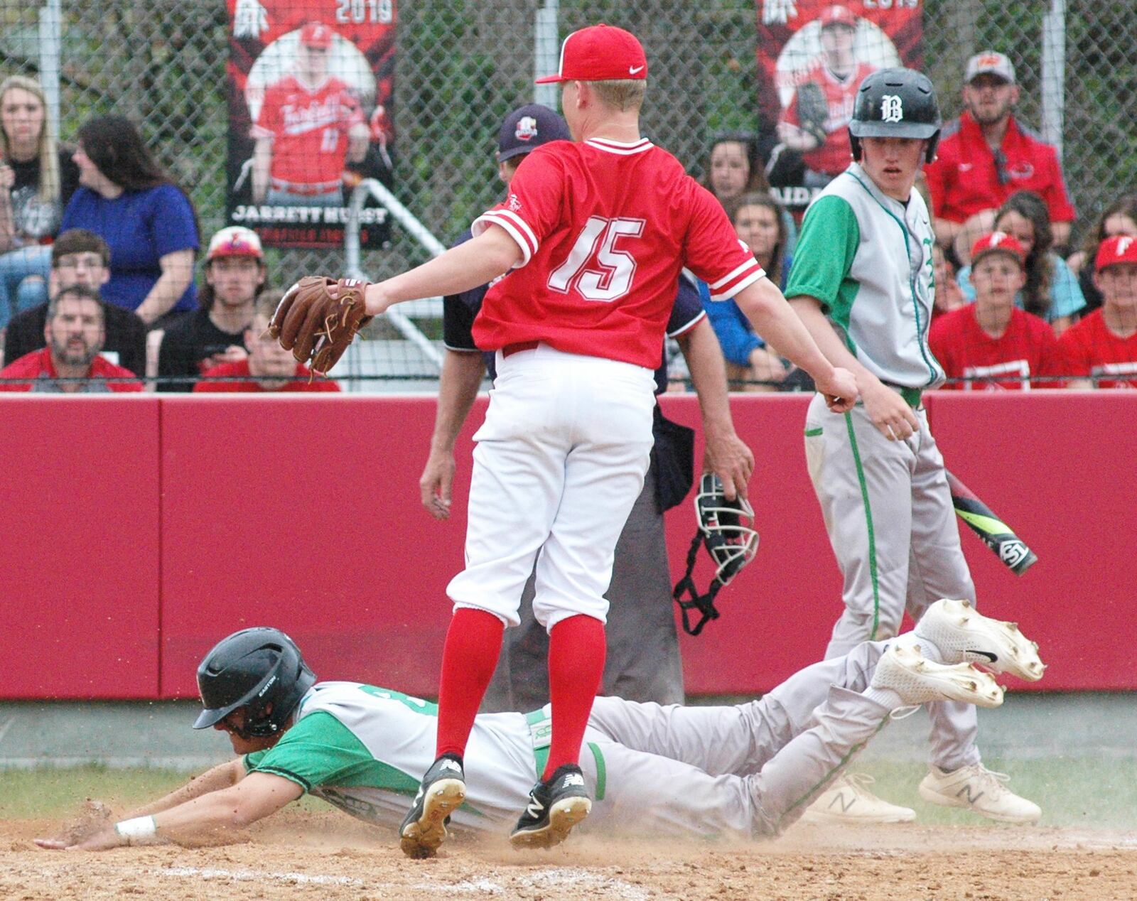 Badin’s Kaden Kimbrell scores on a wild pitch by Fairfield’s Damian Hendricks (15) during Saturday’s nonconference baseball game at Joe Nuxhall Field in Fairfield. Badin won 8-2. RICK CASSANO/STAFF