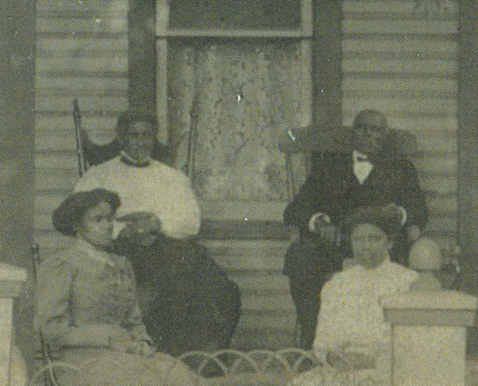 Sarah and Perry Gibson sit in rocking chairs on the porch of their daughter’s home around 1910 with daughter Daisy (Gibson) Bedenbaugh and daughter-in-law Maude (Ayers) Gibson. PHOTO FROM THE SMITH LIBRARY OF REGIONAL HISTORY