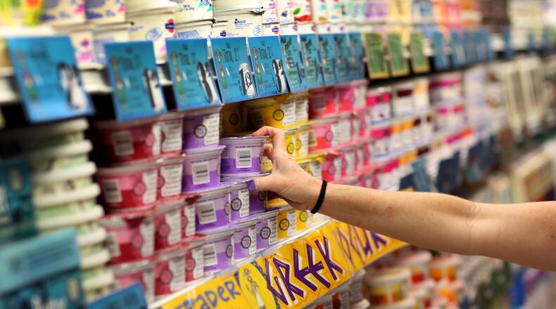 PINECREST, FL - OCTOBER 18: Dawn Moreno shops for yogurt as she enjoys the grand opening of a Trader Joe's on October 18, 2013 in Pinecrest, Florida. Trader Joe's opened its first store in South Florida where shoppers can now take advantage of the California grocery chains low-cost wines and unique items not found in other stores. About 80 percent of what they sell is under the Trader Joe's private label. (Photo by Joe Raedle/Getty Images)