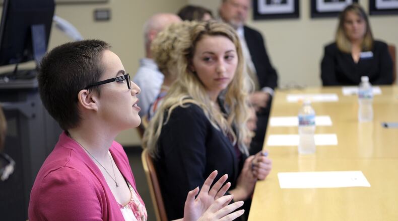 Leighanne Marcum, a senior at Kenton Ridge High School, talks about the College Credit Plus program with Ohio Department of Higher Education chancellor John Carey. Marcum, who is enrolled in the CCP program, is graduating with her high school diploma as well as an associates degree from Clark State. Bill Lackey/Staff