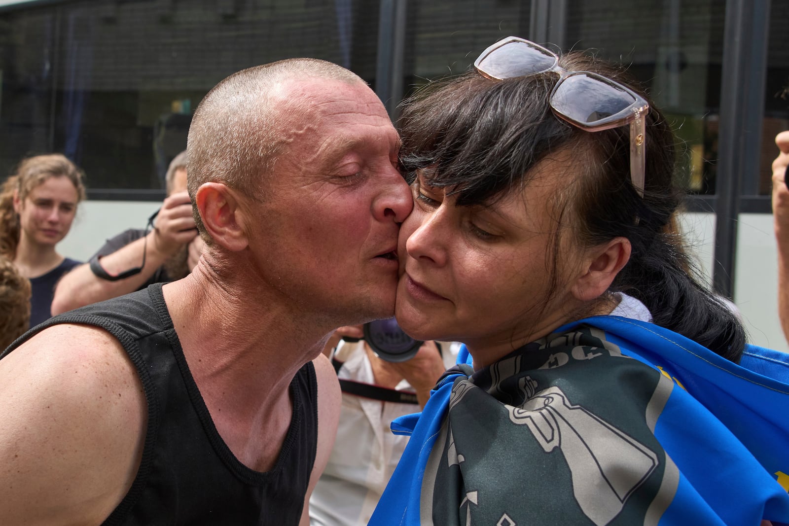The Ukrainian serviceman Vitaly, kisses his wife Olena, after returning from captivity during a POWs exchange between Russia and Ukraine, in Chernyhiv region, Ukraine, Sunday, May 25, 2025. (AP Photo/Efrem Lukatsky)