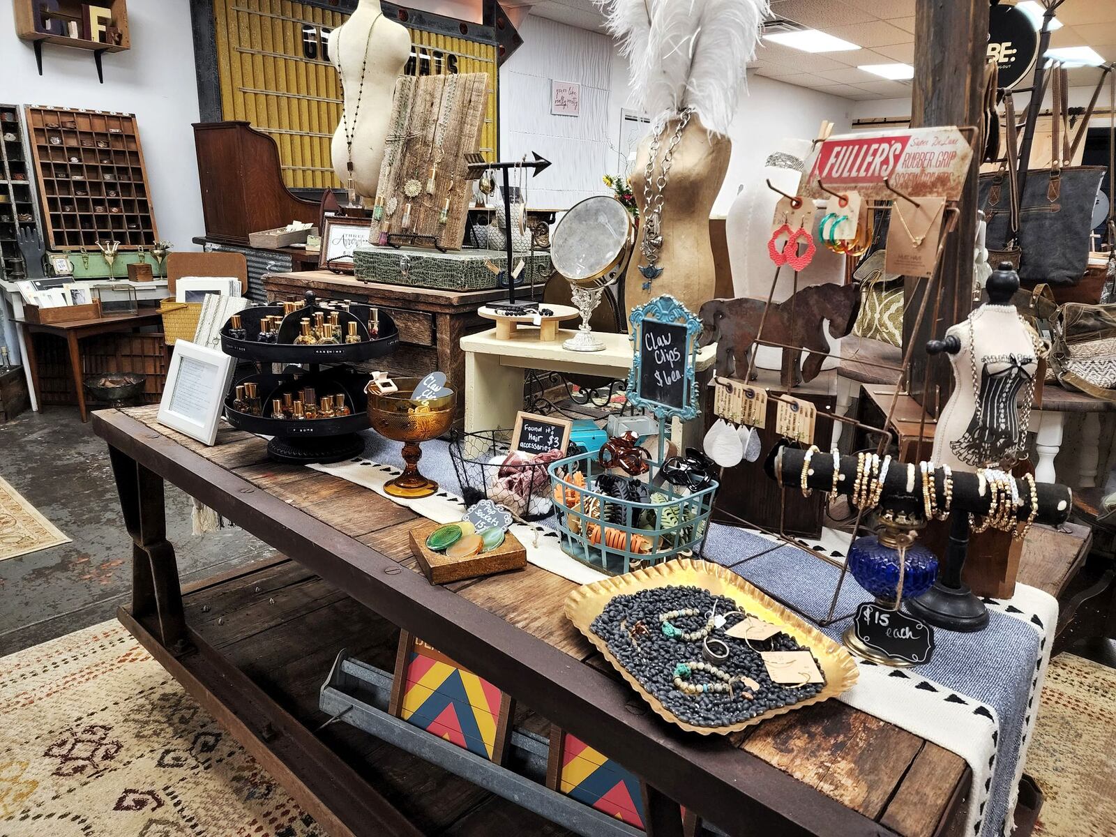 Iron Rose Mercantile and Shades of Chic cabinet painting have opened in a shared space in a renovated building on Ohio 122 in Madison Township. Lisa Dethlefs runs Iron Rose with an eclectic mix of decor, furniture, clothing, gifts, hats, jewelry and more and Susan Cox moved her Shades of Chic business in the back where she paints cabinets for customers. There is a collaborative space for classes, special events and more. NICK GRAHAM/STAFF