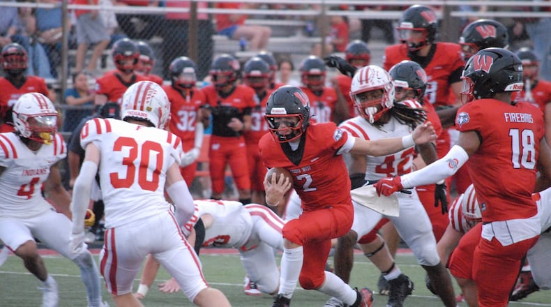 Lakota West's Sam Wiles (2) looks for running room against Fairfield on Friday night. Chris Vogt/CONTRIBUTED