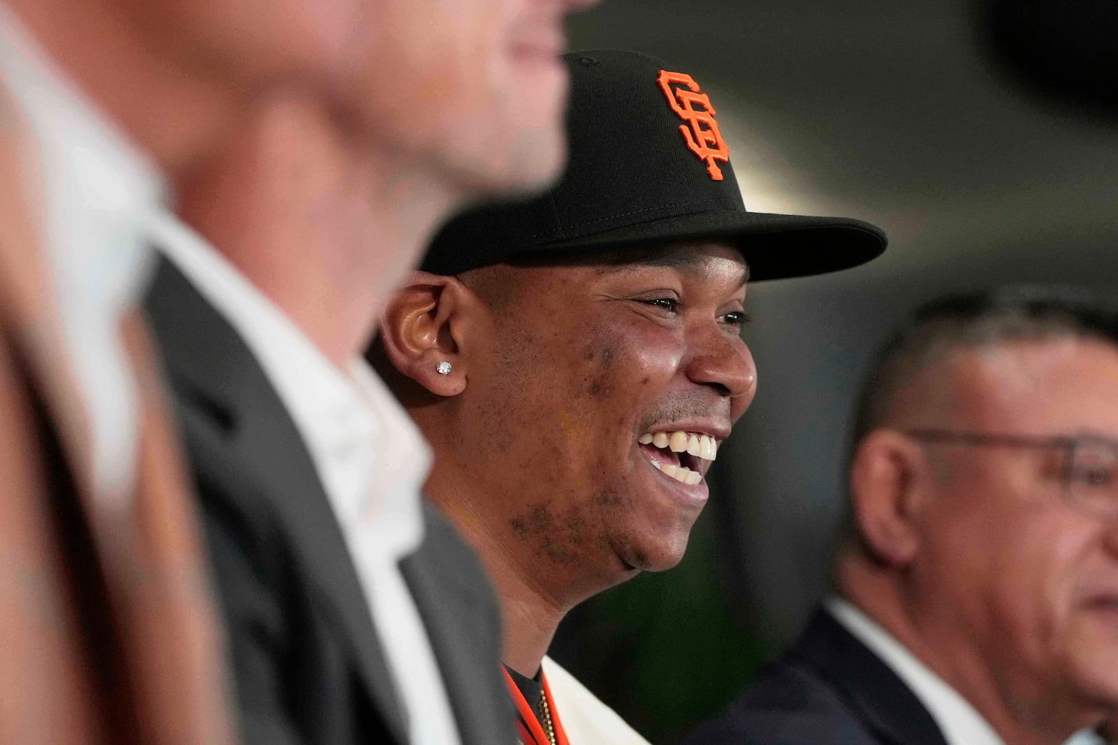 San Francisco Giants' Rafael Devers smiles while speaking at a news conference before a baseball game against the Cleveland Guardians in San Francisco, Tuesday, June 17, 2025. (AP Photo/Jeff Chiu)
