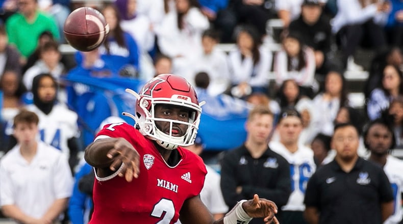 Miami quarterback Aveon Smith throws a pass during an NCAA college football game against Buffalo at UB Stadium in Buffalo, N.Y., Saturday, Oct. 1, 2022. (Joseph Cooke/The Buffalo News via AP)