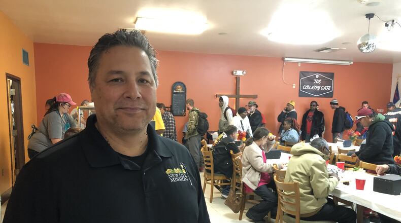 Felix Russo, the pastor and director at New Life Mission in Hamilton, is shown here in November, before coronavirus precautions limited the number of people allowed in the building at once. The mission has already seen an increase in people needing help, while donations have dropped and the mission had to cancel its April banquet fundraiser because of the disease. MIKE RUTLEDGE/STAFF