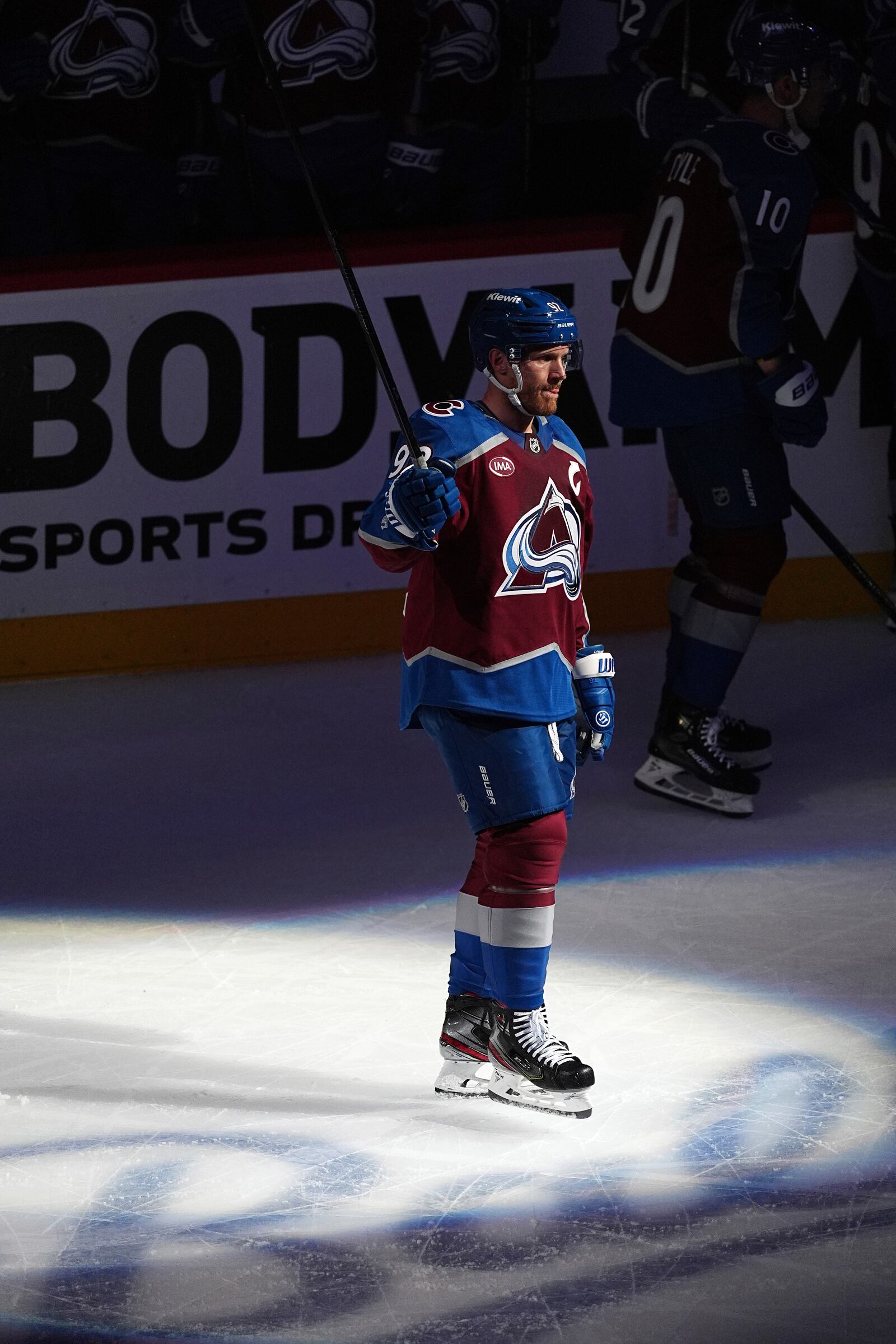 Colorado Avalanche left wing Gabriel Landeskog acknowledges fans as they applaud after a video tribute for the player during a time out in the first period of Game 3 of an NHL hockey first-round playoff series against the Dallas Stars Wednesday, April 23, 2025, in Denver. (AP Photo/David Zalubowski)