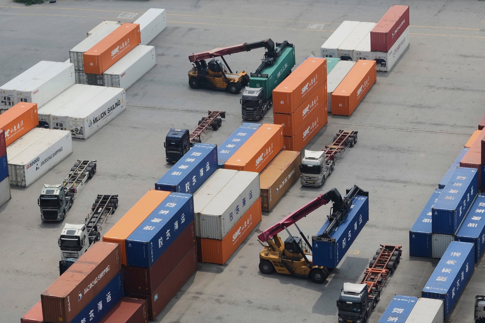 Cranes and shipping containers are seen at a port in Pyeongtaek, South Korea, Tuesday, July 8, 2025. (AP Photo/Ahn Young-joon)
