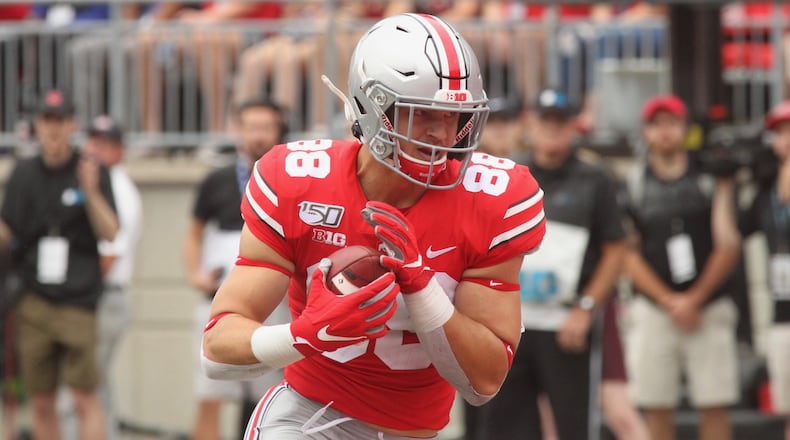 Ohio State tight end Jeremy Ruckert celebrates a touchdown in the first quarter against Florida Atlantic on Saturday, Aug. 31, 2019, at Ohio Stadium in Columbus. David Jablonski/Staff