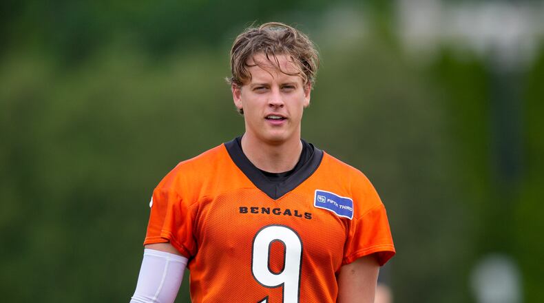 Cincinnati Bengals quarterback Joe Burrow walks off of the field following a NFL football practice, Tuesday, May 28, 2024, in Cincinnati. (AP Photo/Jeff Dean)