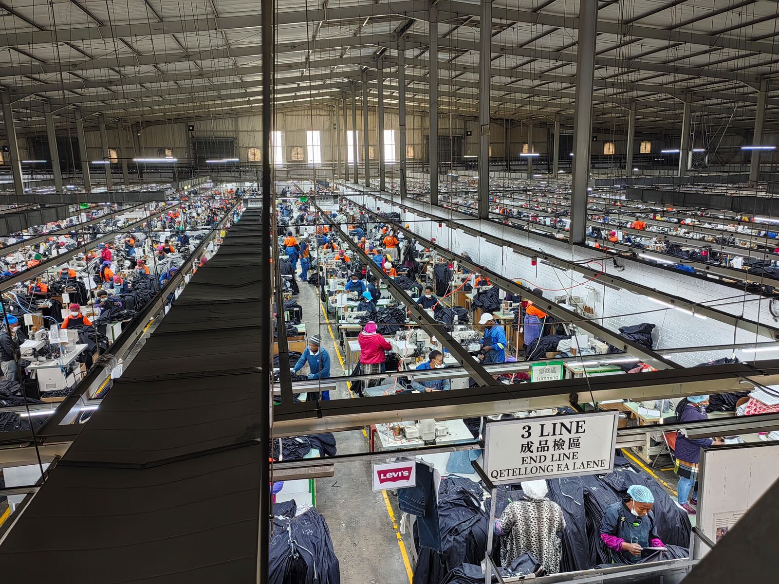 Workers assemble Levi's jeans in the Chinese owned Nien Hsing International factory in Maseru, Lesotho, Wednesday, April 9, 2025. (AP Photo/Keketso Phakela)