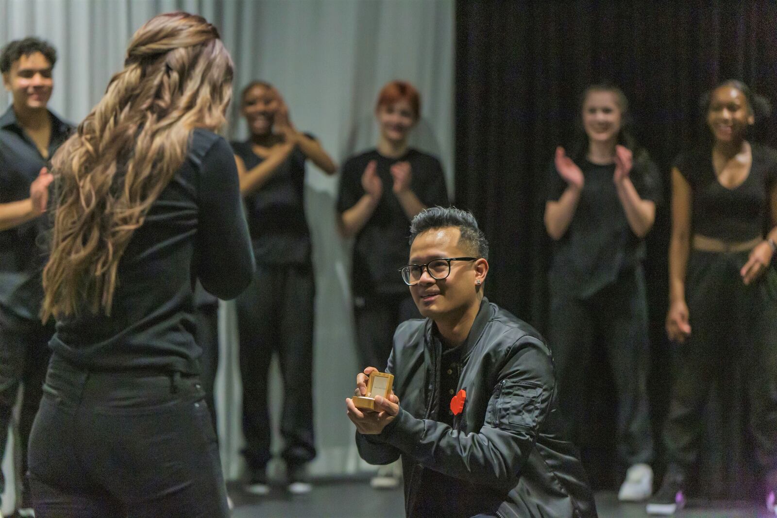 Butler Tech Principal and Creative Director Kimheart Moeung recently staged a flash mob dance performance - using high school dancers - to make his  marriage proposal to Fairfield High School ESL tutor Lindsay Cator. Moeung enlisted his Butler Tech high school student dancers and then lured Cator to the Fitton Center for Creative Arts' auditorium, passing off the flash mob dance as a performance by the teens with her sitting front row center. (Provided Photo\Journal-News)