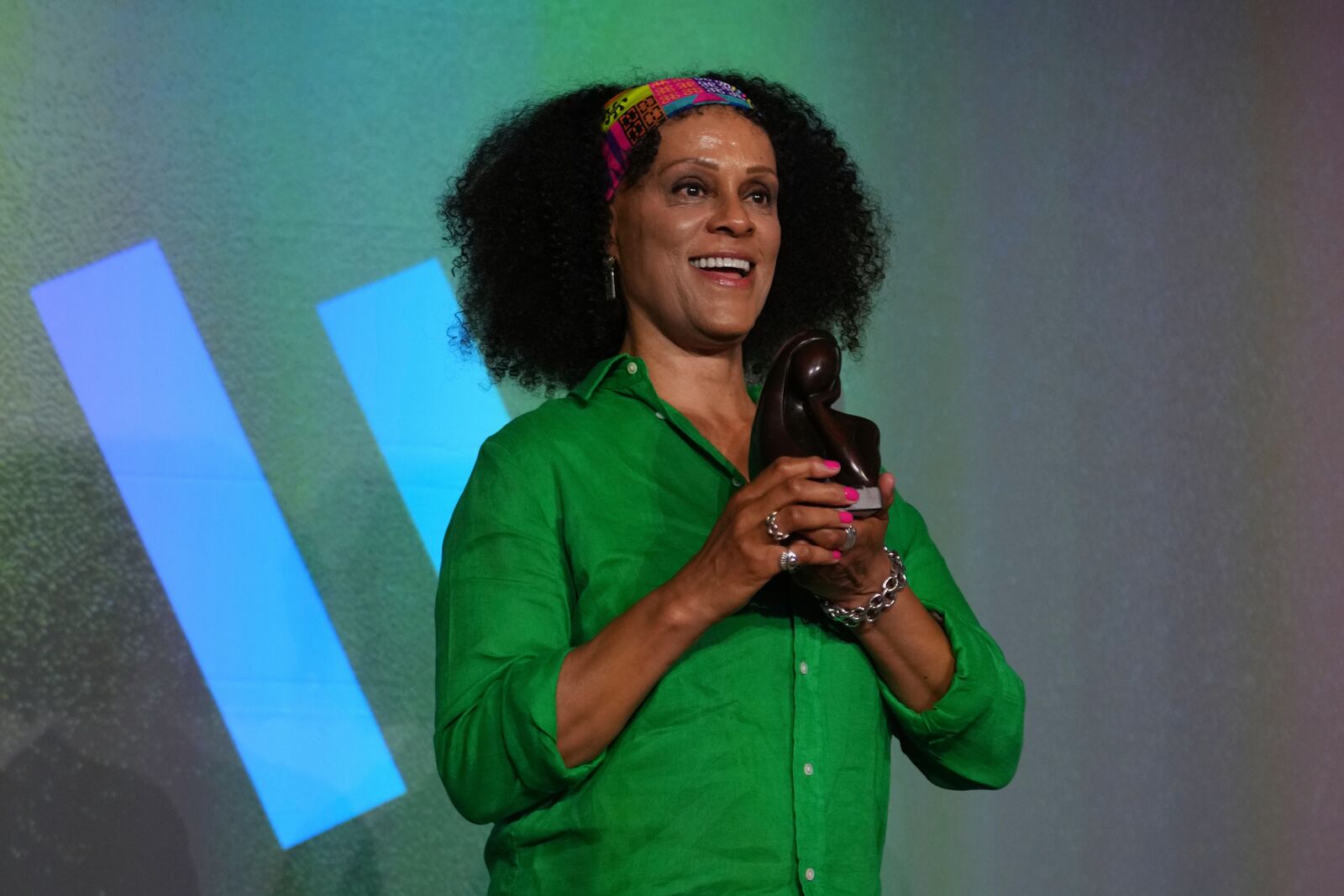 Women's prize outstanding contribution award winner Bernardine Evaristo, poses with her trophy, at the prize giving event, in London, Thursday, June 12, 2025. (AP Photo/Joanna Chan)