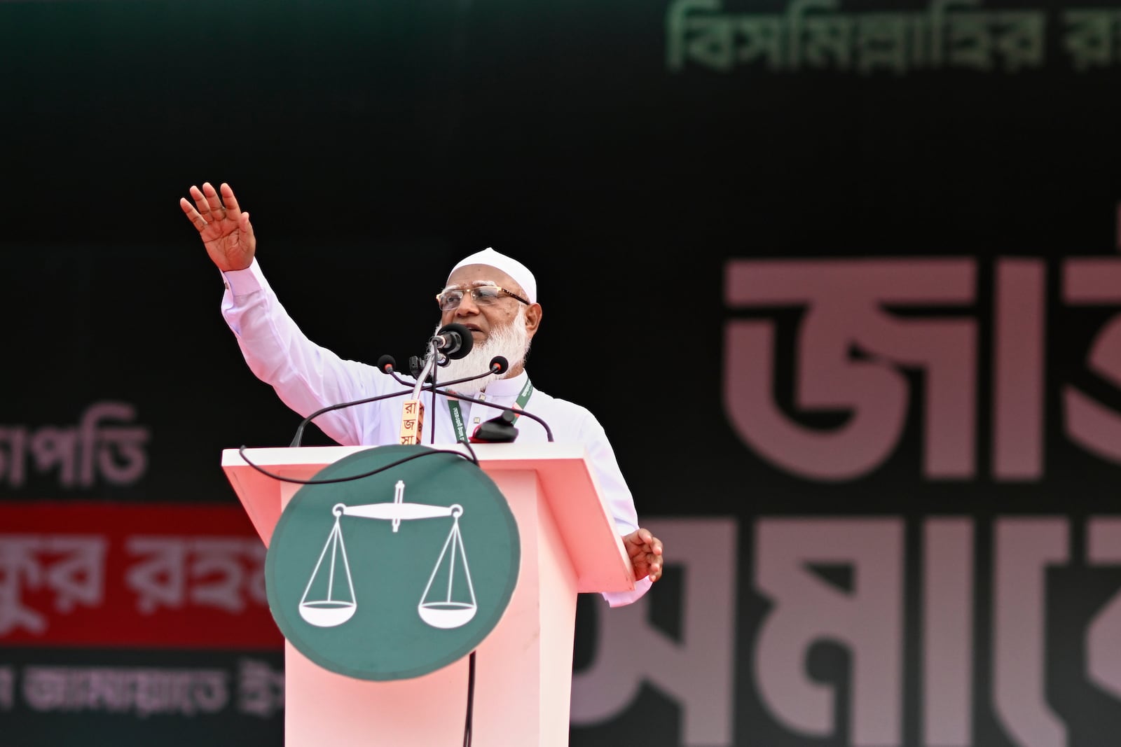 Leader of Bangladesh's largest Islamist party Jamaat-e-Islami, Shafiqur Rahman, addresses a rally in a show of strength ahead of elections expected next year, in Dhaka, Bangladesh, Saturday, July 19, 2025. (AP Photo/Mahmud Hossain Opu)