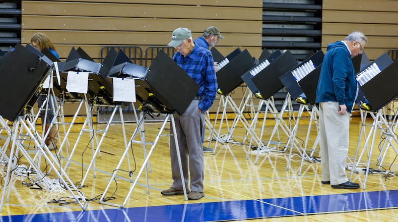 Voters cast their ballots at the polling location in the gymnasium of Garfield Middle School Tuesday, Nov. 4, 2025 in Hamilton. NICK GRAHAM/STAFF