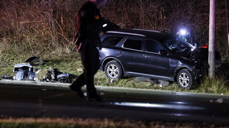 A motorcycle and SUV were involved in a crash Friday night on Ohio 122 at West Alexandria Road in Madison Twp. in Butler County. A Trenton woman, a passenger on the motorcycle, was pronounced dead at the hospital, according to the Butler County Sheriff's Office. NICK GRAHAM/STAFF