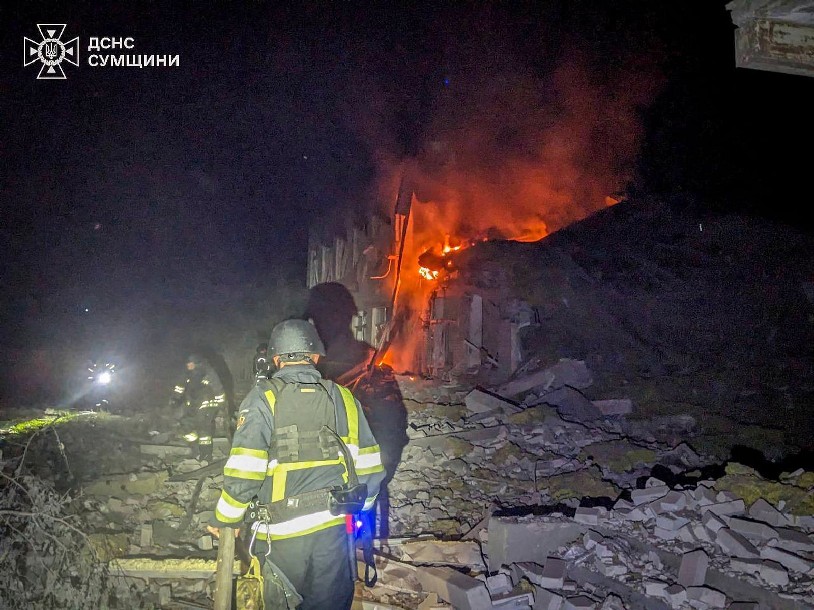In this photo provided by the Ukrainian Emergency Service, firefighters put out the fire of a city hospital following a Russian attack in Sumy region, Ukraine, Tuesday, July 15, 2025. (Ukrainian Emergency Service via AP)
