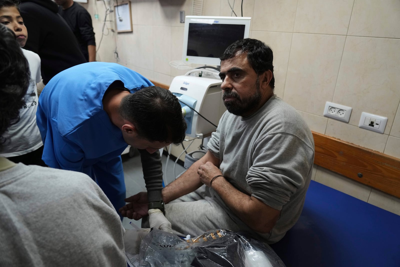 Freed Palestinian prisoner Samir Abu Ghanem, who was detain by the Israeli army during its ground operation in the Gaza Strip, arrives at al-Aqsa Hospital in Deir al-Balah, central Gaza, after his release from an Israeli prison, Tuesday, April 29, 2025. (AP Photo/Abdel Kareem Hana)