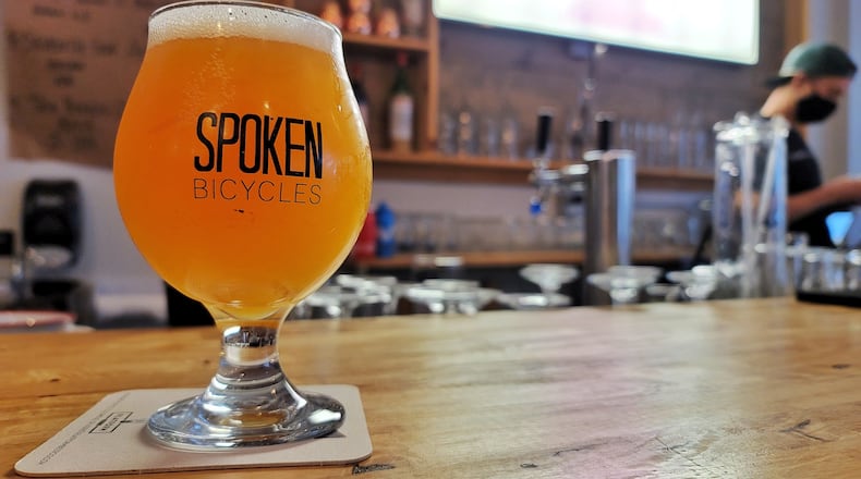 Spoken Bicycles on Central Ave. in Middletown is a full service bike shop offering sales, service, parts and accessories but is also a craft beer and cocktail bar with rotating taps. NICK GRAHAM / STAFF