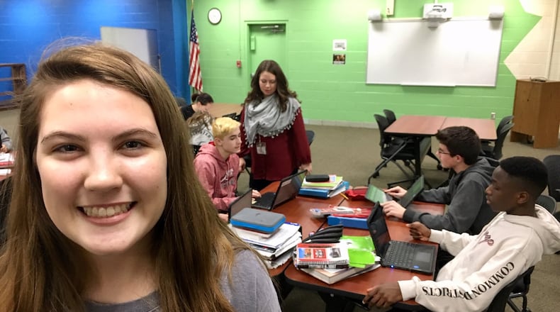 Lakota West Freshman School student Lora Broz stands in the school’s new “innovation hub” she helped to design. The West Chester Township school is the latest in the district to open a re-designed media center. Broz’s suggestions, which she presented to district officials, include the hub’s bright colors and wheels on all chairs, tables for quick mobility in switching student projects into paired or team efforts.