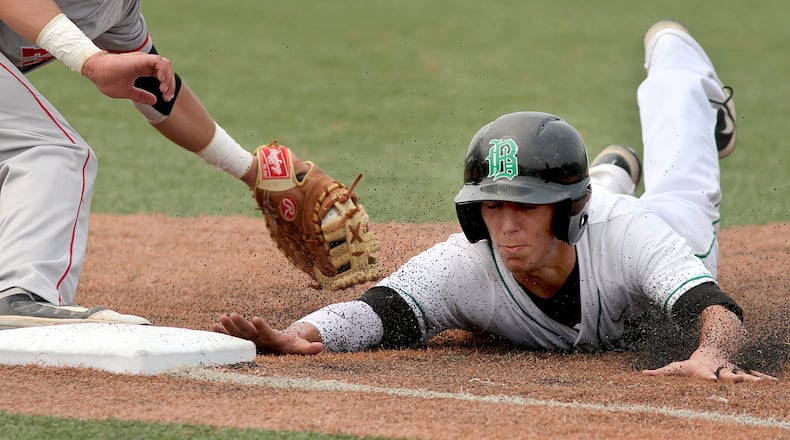 Badin’s T.J. Nichting jumps back to first to avoid the pickoff attempt by Fredericktown first baseman Tristan Caudill during a Division III regional championship game at the Athletes in Action complex in Xenia on May 25, 2012. CONTRIBUTED PHOTO BY E.L. HUBBARD