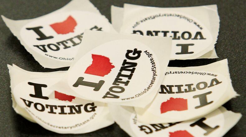Voting stickers lay on a table   (Photo by Jay LaPrete/Getty Images)