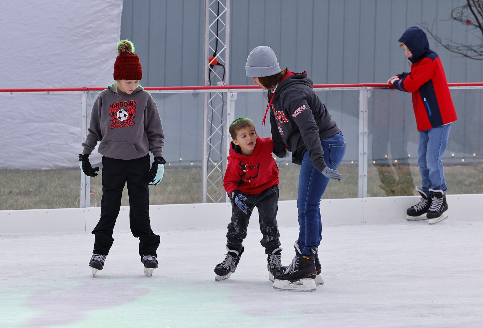 People enjoy the ice skating rink, part of Middletown Holiday Whopla, Saturday, Nov. 27, 2021 in downtown Middletown. NICK GRAHAM / STAFF