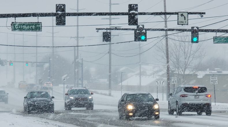 Snow blanketed Butler County causing slick roads and school closings. NICK GRAHAM / STAFF